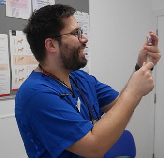 Vet preparing medicine